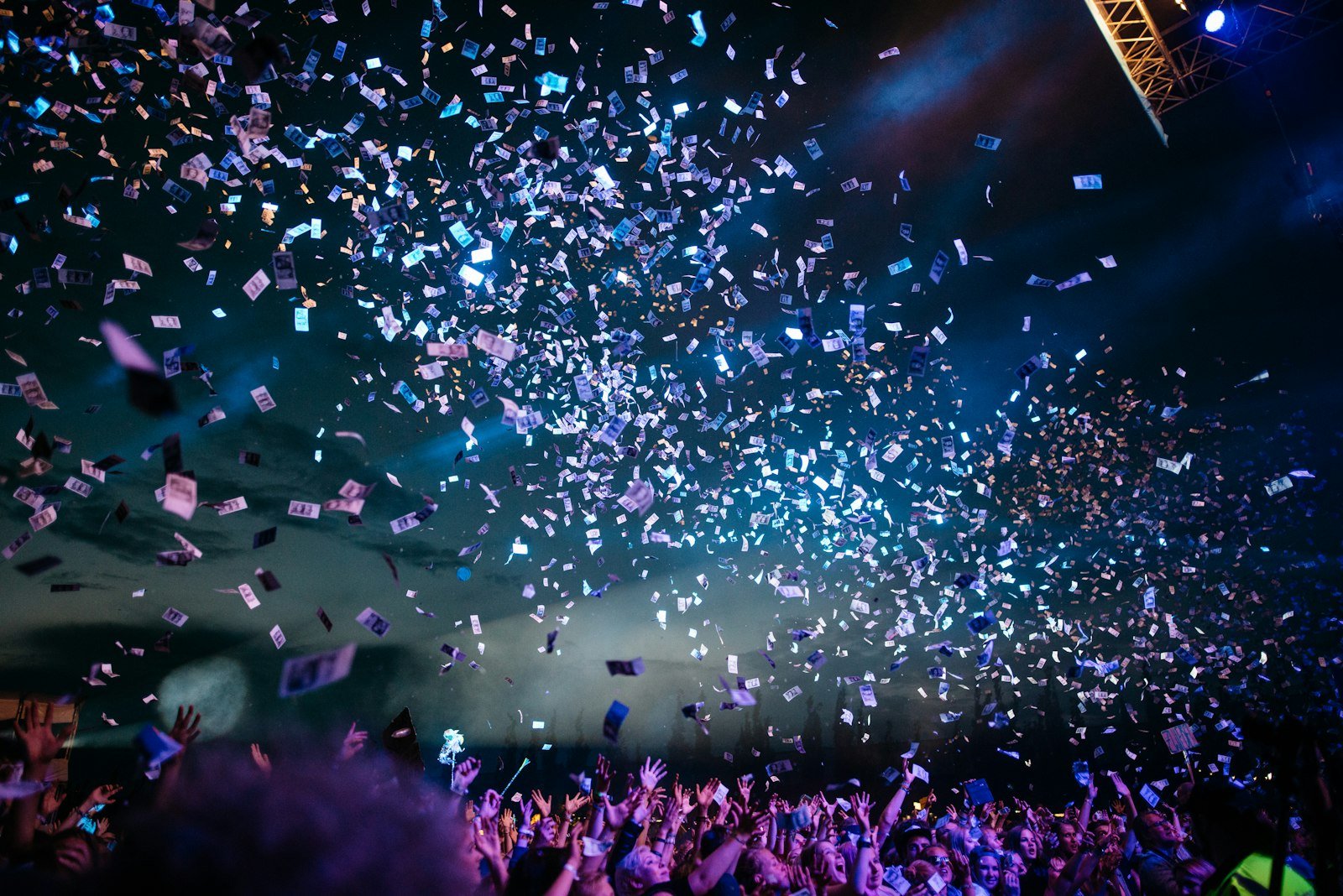 Live concert crowd under stage lights